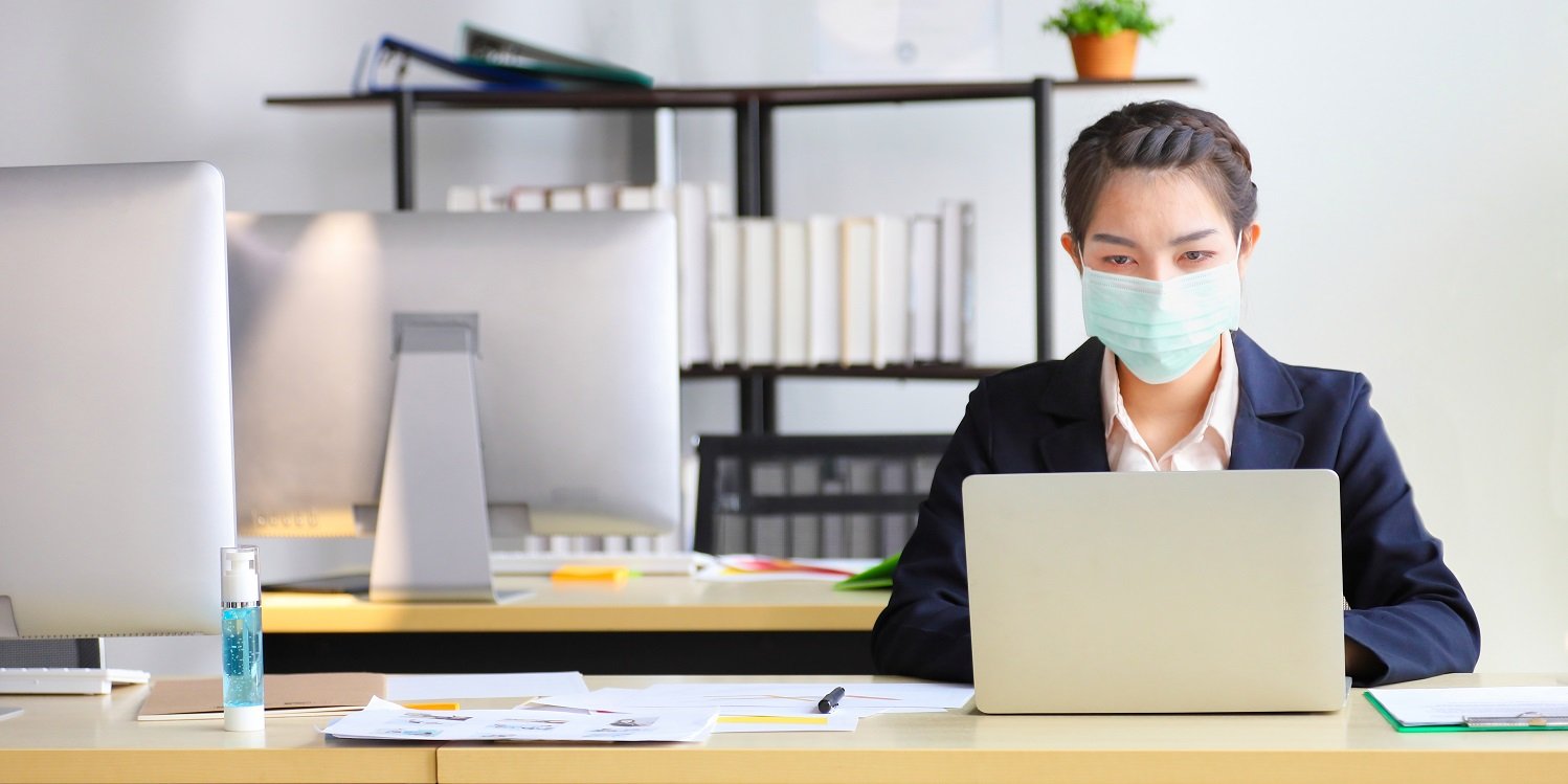 Employee at work wearing mask to avoid absence